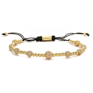 Adjustable black woven bracelet with gold beads and micro-pave cubic zirconia spheres