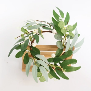 Detail of eucalyptus leaves and white pearls on a 30cm artificial candle ring decor