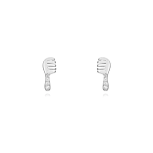 Detailed view of silver comb shaped stud earrings featuring small sparkling gemstones