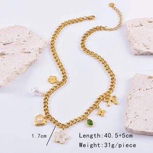 Detail view of gold chunky necklace with pearl, heart, and flower charms and sizing metrics