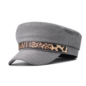 Close-up of grey cadet cap featuring a stylish leopard print chain band on front