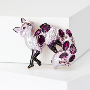Elegant purple enamel fox brooch with sparkling crystals on white geometric stand