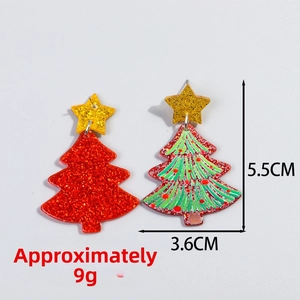 Detail view showing 5.5cm glittery acrylic Christmas tree earrings with red and green patterns