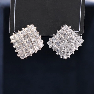 Macro shot of silver geometric square earrings with full micro-pave cubic zirconia crystals
