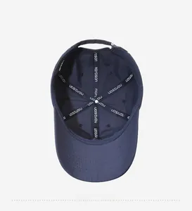 Detail view of reinforced stitching and branded inner tape on navy blue baseball cap