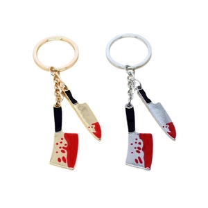 Halloween knife keychains in gold and silver finish with red blood stains on white background