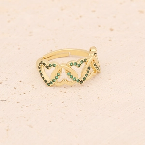 Macro detail of gold-plated open ring featuring three interconnected green zircon hearts
