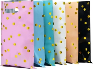 Detailed view of colorful plastic gift bags with golden dots and die-cut handles
