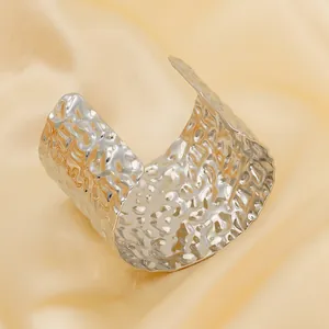 Minimalist silver hammered stainless steel wide cuff bracelet on champagne silk
