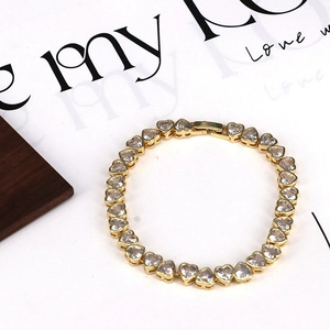 Detail of 18k gold heart bracelet showing sparkling cubic zirconia and secure clasp