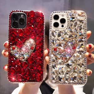 Luxury rhinestone iPhone case with sparkling diamond heart pattern in red and silver