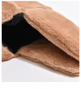 Detailed close-up of thick brown faux fur with warm black lining for winter earflap hats