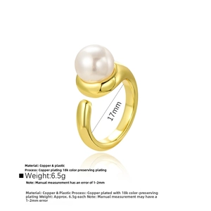 Detailed view of adjustable 18k gold plated ring with a large white pearl bead