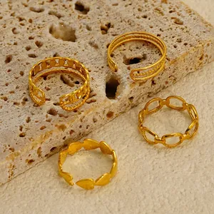 Set of four 18K gold-plated stainless steel rings with heart and chain designs