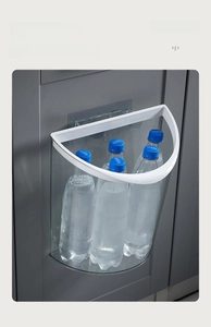 Detail of wall-mounted clear kitchen bin showing strong load-bearing capacity with water bottles