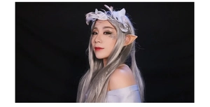 Detail of skin-toned pointed elf ears with white feather crown for cosplay parties