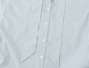 Detail of striped poplin shirt showing button placket and stylish scarf-tie neckline