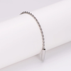 Polished silver rope chain bracelet with a sleek square bar pendant on a minimalist stand