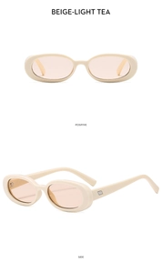 Detail view of oval beige sunglasses with light tea lenses and silver metal hinges