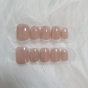 Set of 10 reusable short French nude pink press-on nails with white tips on white fur