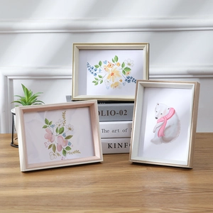 Minimalist Nordic wooden photo frames in natural oak and gold accents for desk or wall display