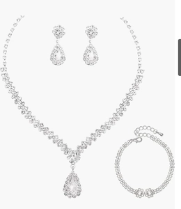 Detail of silver waterdrop jewelry set with sparkling rhinestones on necklace and earrings