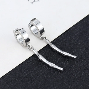 Detailed view of silver bamboo-style pendant earrings with stainless steel hoop closure