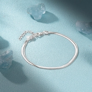 Detail of double-layer 925 sterling silver snake chain bracelet with lobster clasp