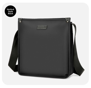 Detailed side view of a black vertical business shoulder bag with metal rivet accents