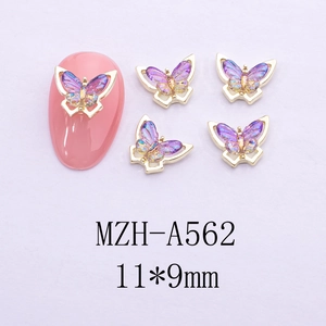Detailed macro of 11x9mm purple resin butterfly nail art charm with gold metal edges