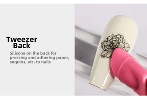 Close-up of pink silicone press head on nail tweezers for securing stickers and sequins