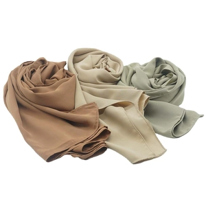 Three elegant pleated satin chiffon scarves in brown, beige, and light green colors