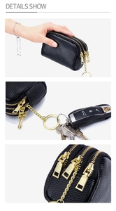 Detailed views of a black litchi leather coin purse with triple golden zippers and keychain