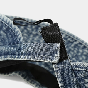 Adjustable denim sun visor hat with velcro strap and elastic band detail