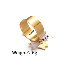 Detailed close-up showing 18mm inner diameter and pink butterfly charm on golden ring