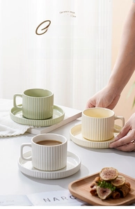 Close-up of European style vertical stripe ceramic coffee cup set with microwave safe label