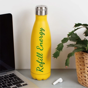Bright yellow stainless steel insulated water bottle on an office desk with green plants