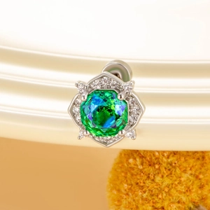 Silver octagonal rose stud earring with a teal crystal centerpiece and halo pavé diamonds