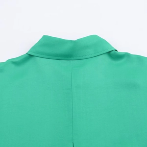 Green satin shirt back collar detail showcasing professional stitching and smooth texture