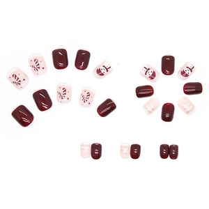 Short red Christmas press-on nails with cute snowman and candy cane festive designs
