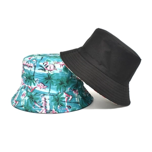 Reversible bucket hat detail showing tropical flamingo print and solid black cotton canvas