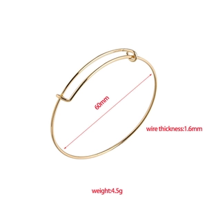 Polished golden stainless steel adjustable wire bangle, 60mm diameter and 1.6mm thickness