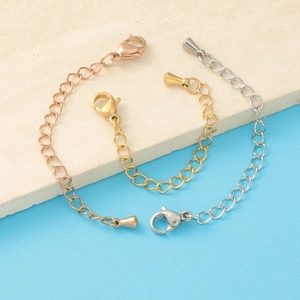 Detail of stainless steel extender chains with lobster clasps and tapered metal charms