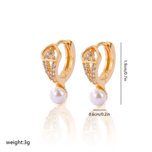 Detail view of gold plated earrings with white pearl and zircon showing 1.9cm height size