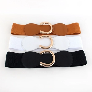 Three elastic waist belts in brown, white and black with golden C-shaped buckles