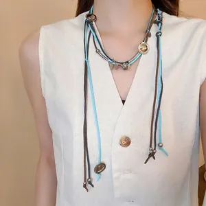 Bohemian multi-layer suede cord necklace with sun pendants and metallic accents
