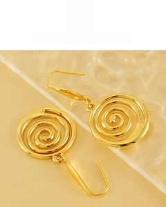 Detail showing 18K gold plated spiral earrings with a vibrant and durable finish