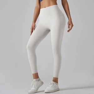 Detail of high waisted yoga leggings with side pockets and smooth seamless finish