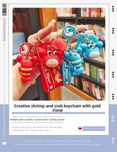 Close-up of red lobster and crab keychains with Rich Man silicone wrist straps