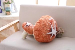 Detail of mushroom plush pillows in two sizes on a cozy sofa with lifelike texture